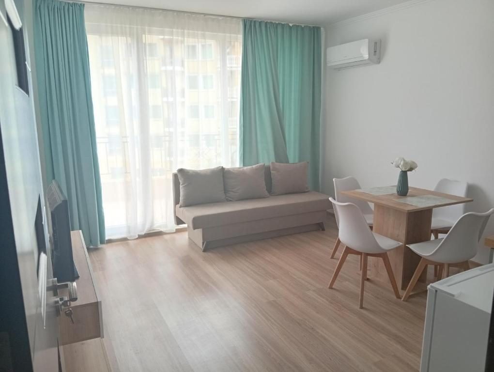 Bright living area with sofa and dining table